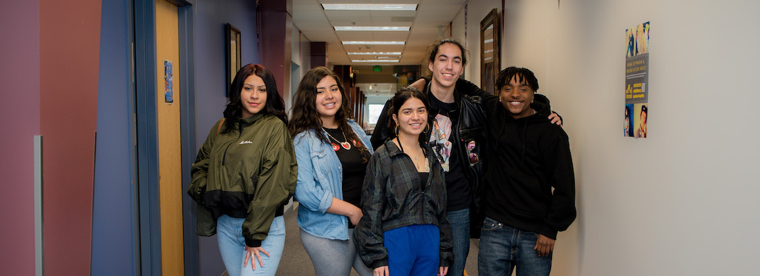 Group of students posing in the hallway